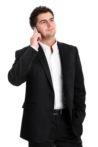 a young businessman talking on the phone against white background