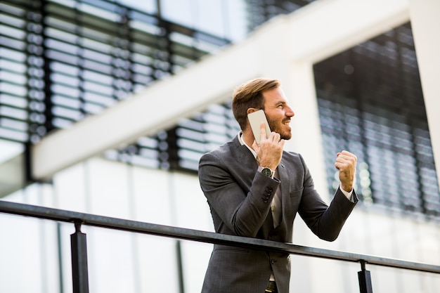 Young businessman talking over the phone