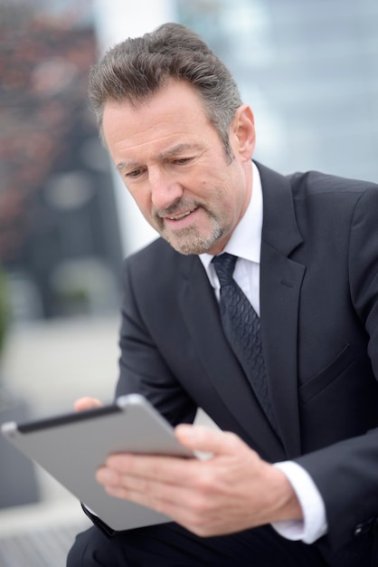 Young businessman using digital tablet