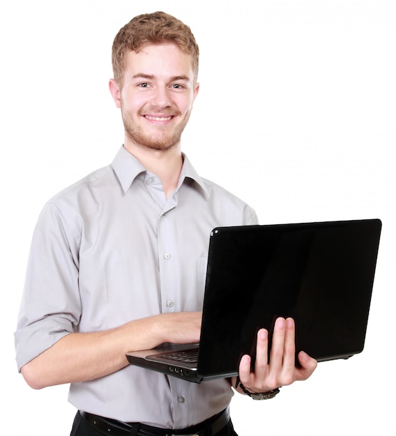 Young businessman using laptop pc