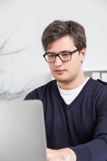 Young businessman using laptop