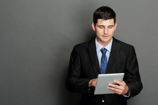 Young businessman using tablet pc