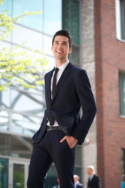 Young businessman walking in the city