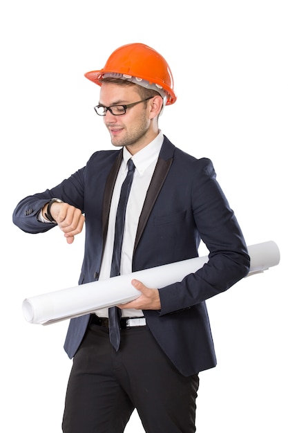 Young businessman wear a safety helmet looking at his watches