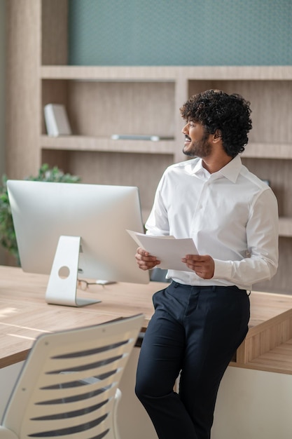 Young businessman in white shirt in the office