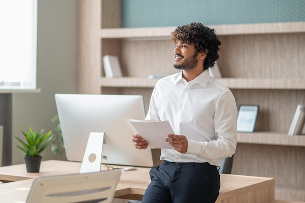 Young businessman in white shirt in the office