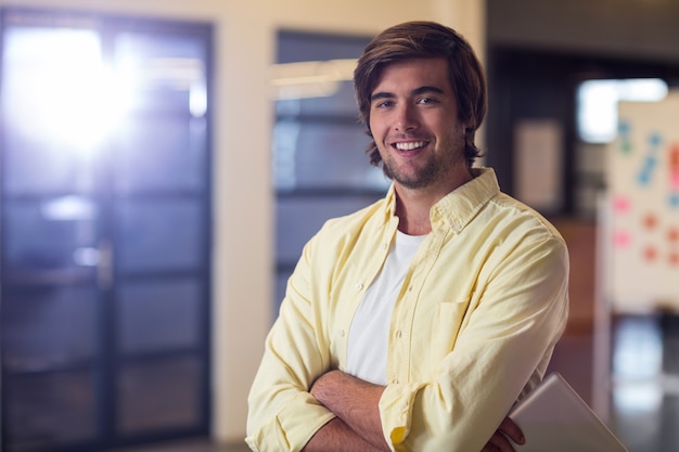 Young businessman with arms crossed