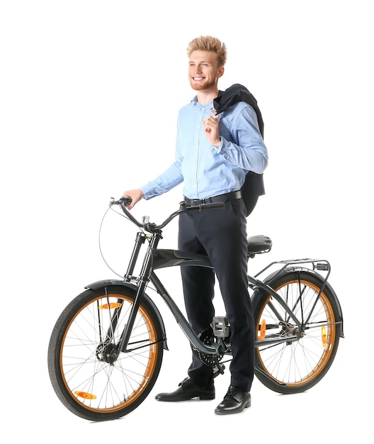 Young businessman with bicycle on white space