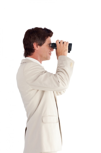 Young businessman with binoculars 
