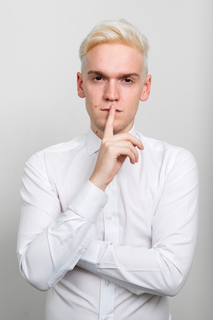 young businessman with blond hair on white