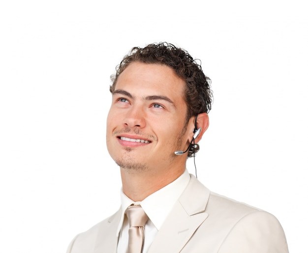 Young businessman with headset on looking up 