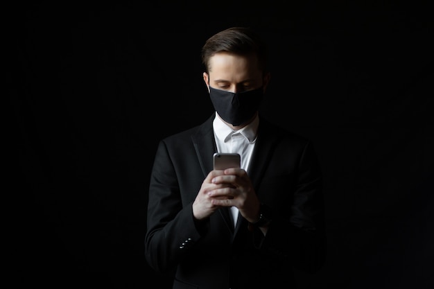 Young businessman with mask for protection from corona virus  