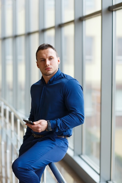 Young businessman with mobilephone. 