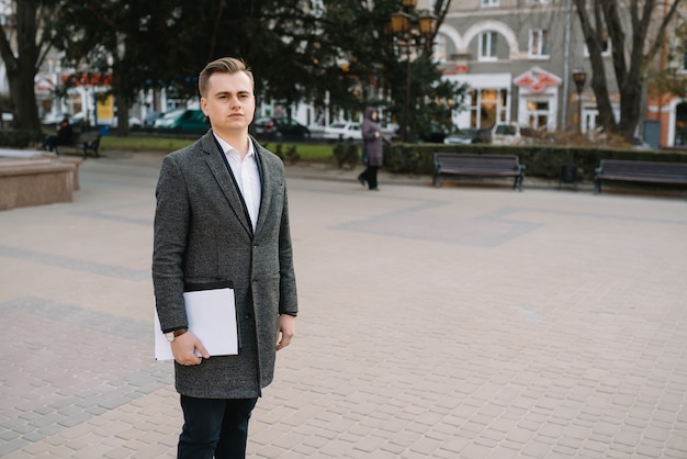 Young businessman with paperwork