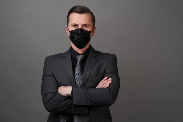 Young businessman with surgical medical mask