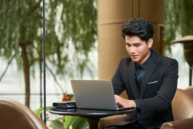 Young businessman working on laptop