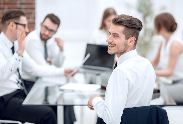 Young businessman at a working meeting with the business team