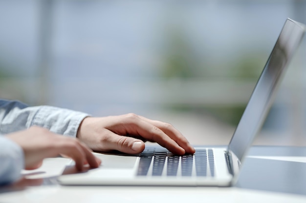 Young businessman working with laptop at office. a man using a modern laptop