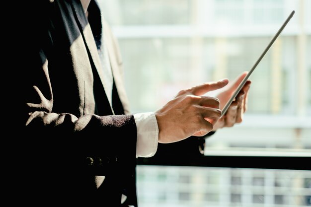 young businessman working with mobile laptop and documentsin office