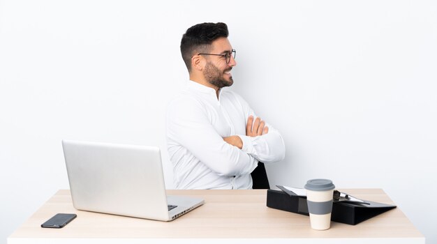 Young businessman in a workplace in lateral position