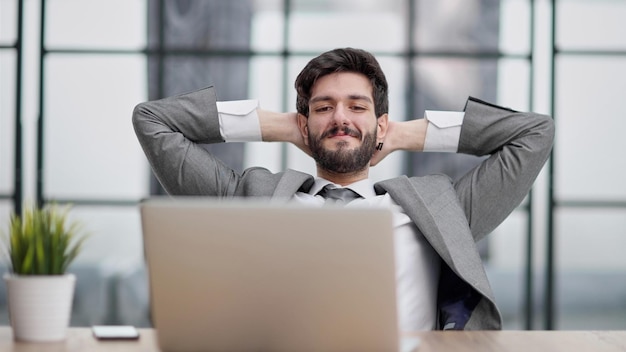 Young businessman your hands on the back of your head