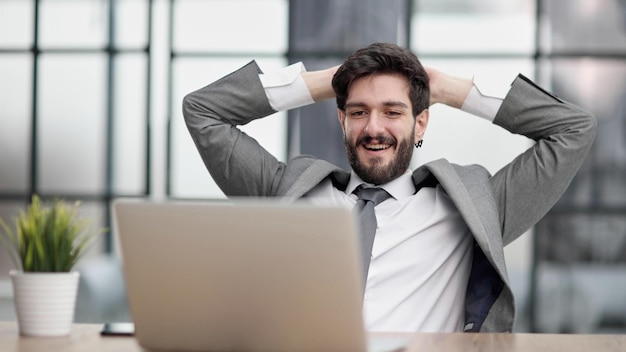 Young businessman your hands on the back of your head