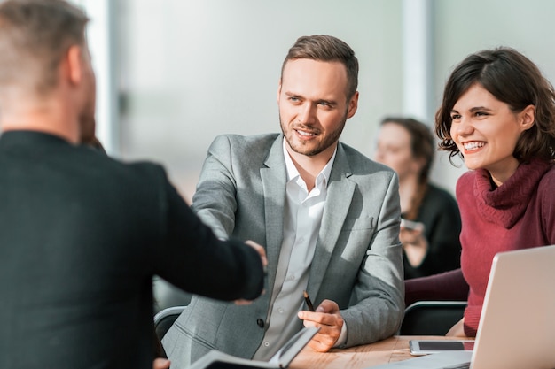 Young businessmen confirm the deal with a handshake