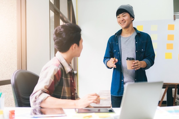 young businessmen discussing in office