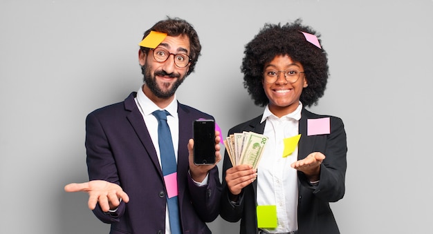 Young businesspeople smiling happily