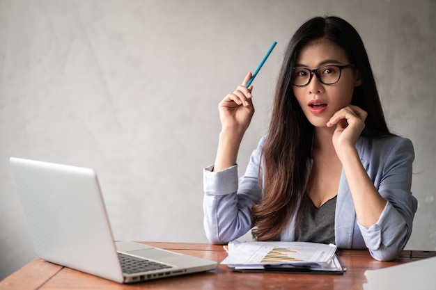 Young businesswoman in blue jacket