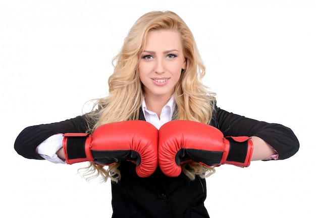 Young businesswoman in boxing concept.