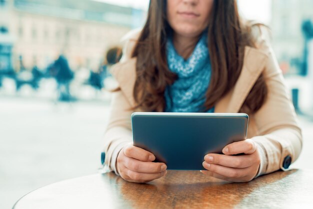 Young businesswoman checking tablet