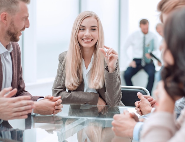 Young businesswoman explaining new tasks at a working meeting