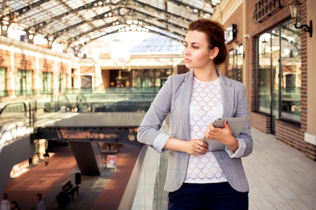 Young businesswoman in a gray jacket