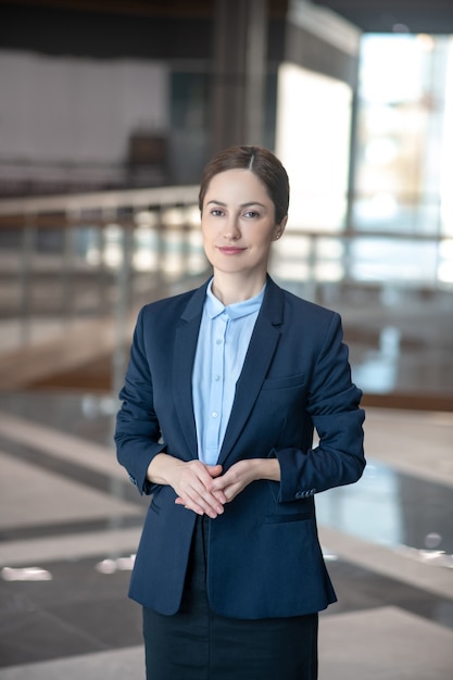 Young businesswoman in her uniform