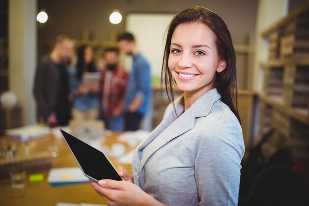 Young businesswoman holding digital tablet