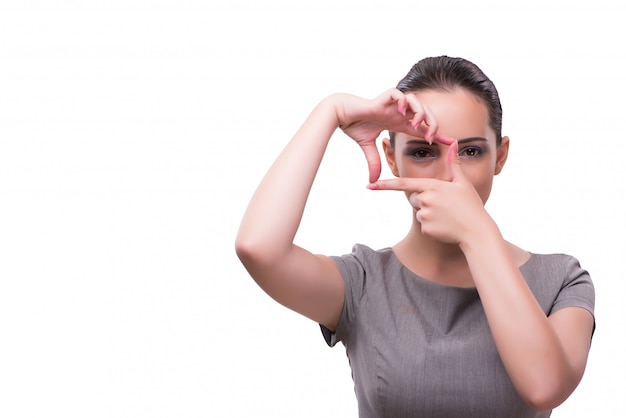 Young businesswoman holding hands in frame shape