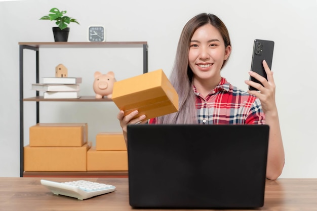 A young businesswoman is very happy after checking her email through her laptop