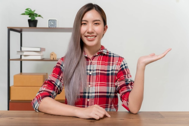 A young businesswoman is very happy after checking her email through her laptop