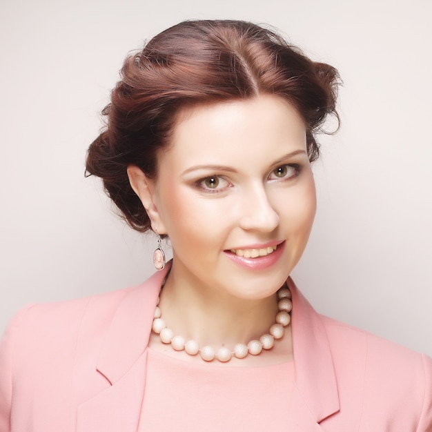 Young businesswoman in pink close up