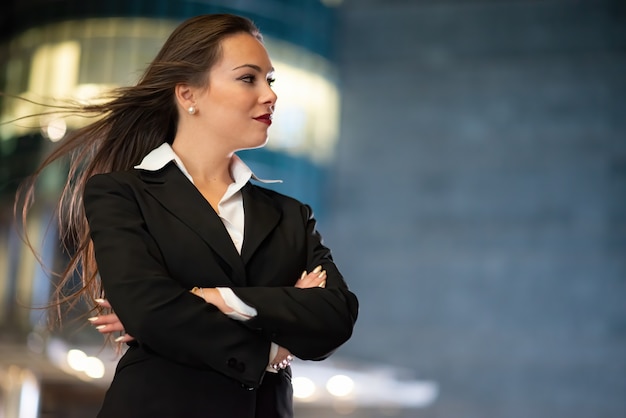 Young businesswoman portrait in a modern city setting at night