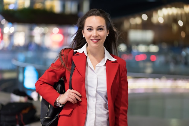 Young businesswoman portrait in a modern city setting at night