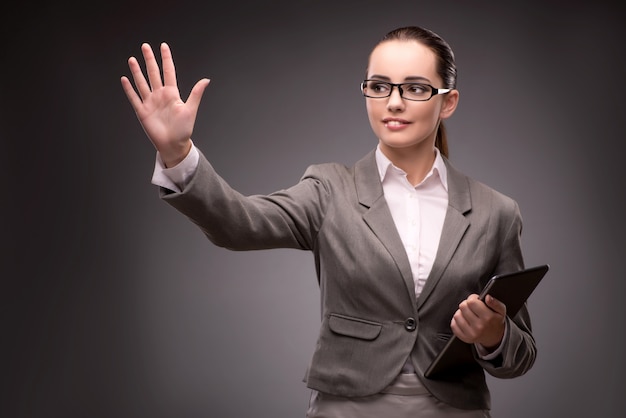 Young businesswoman pressing virtual button