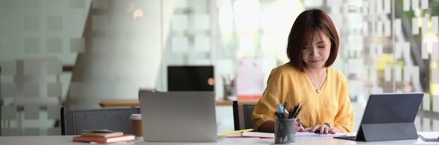 young businesswoman sitting in modern workspace