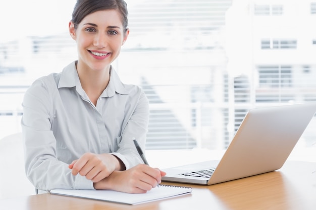 Young businesswoman smiling at camera