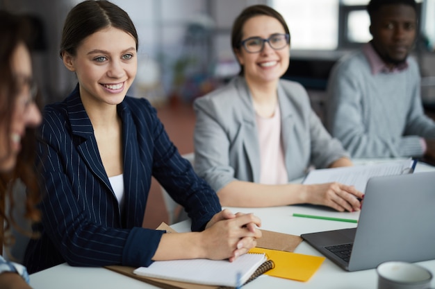 Young Businesswoman Smiling in Meeting