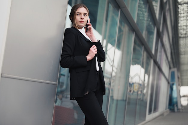 Young Businesswoman speaking on the phone outdoor