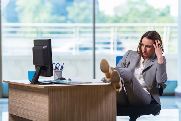 Young businesswoman tired after long working day