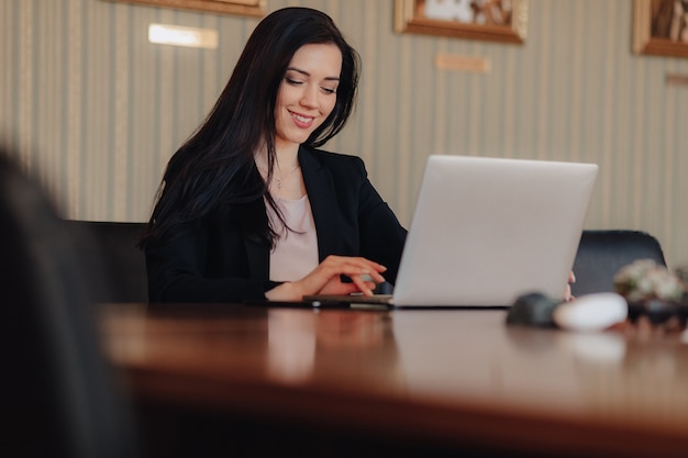 Young businesswoman using a laptop