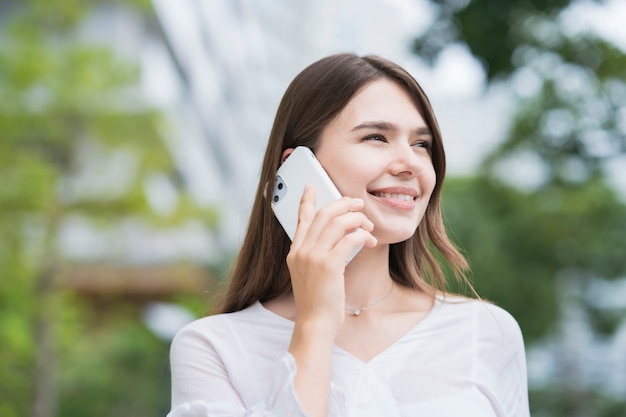 Young businesswoman using the smartphone